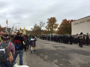 a wall of black uniformed militia