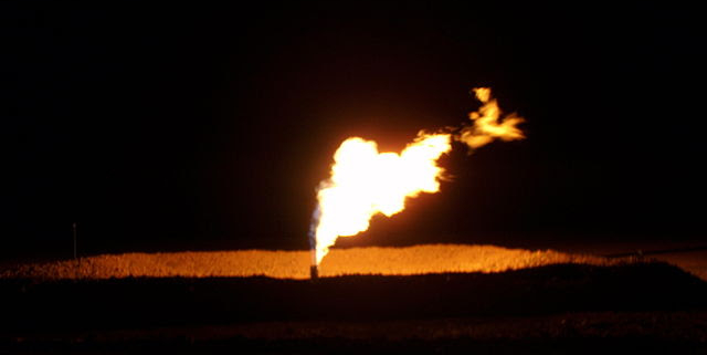 oil field flare at night